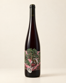 Symbiose 2022 wine bottle, front label, warm cream studio background