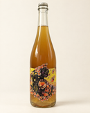 Bigarrure Pétillant Naturel wine bottle, front label, warm cream studio background